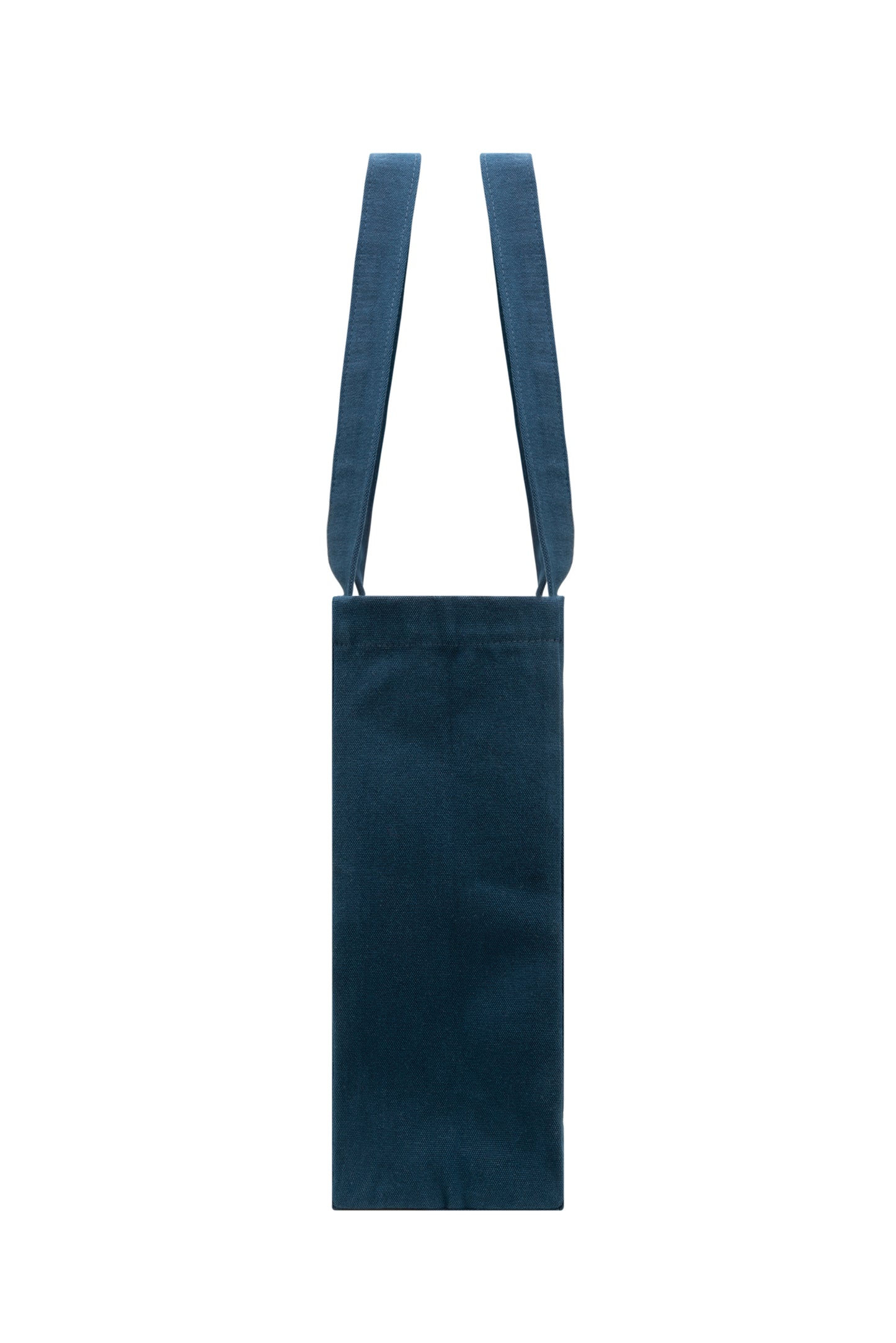 Slim side profile of dark blue cotton tote bag with sturdy seams - durable and structured for everyday use.