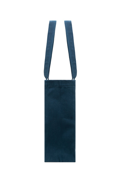Slim side profile of dark blue cotton tote bag with sturdy seams - durable and structured for everyday use.