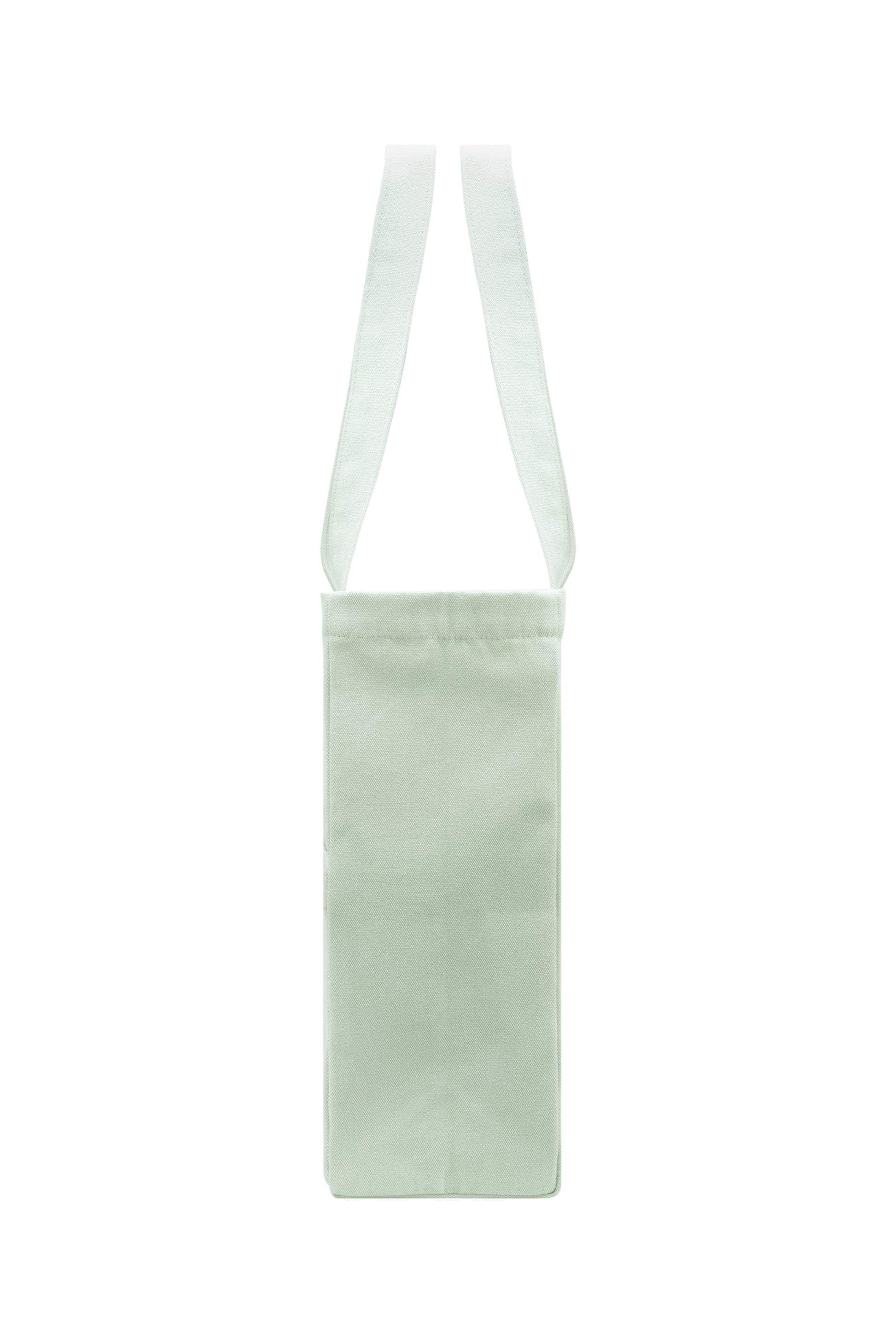 Slim side profile of seafoam green cotton tote bag - structured and elegant with reinforced seams.
